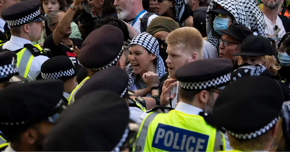 UK police officers arrest protesters supporting banned Palestinian group