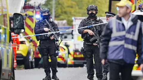 Police officers guard Manchester synagogue after antisemitic terror attack