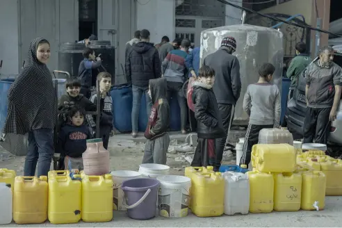 Aid workers distributing water and sanitation supplies in Gaza after UK pledge